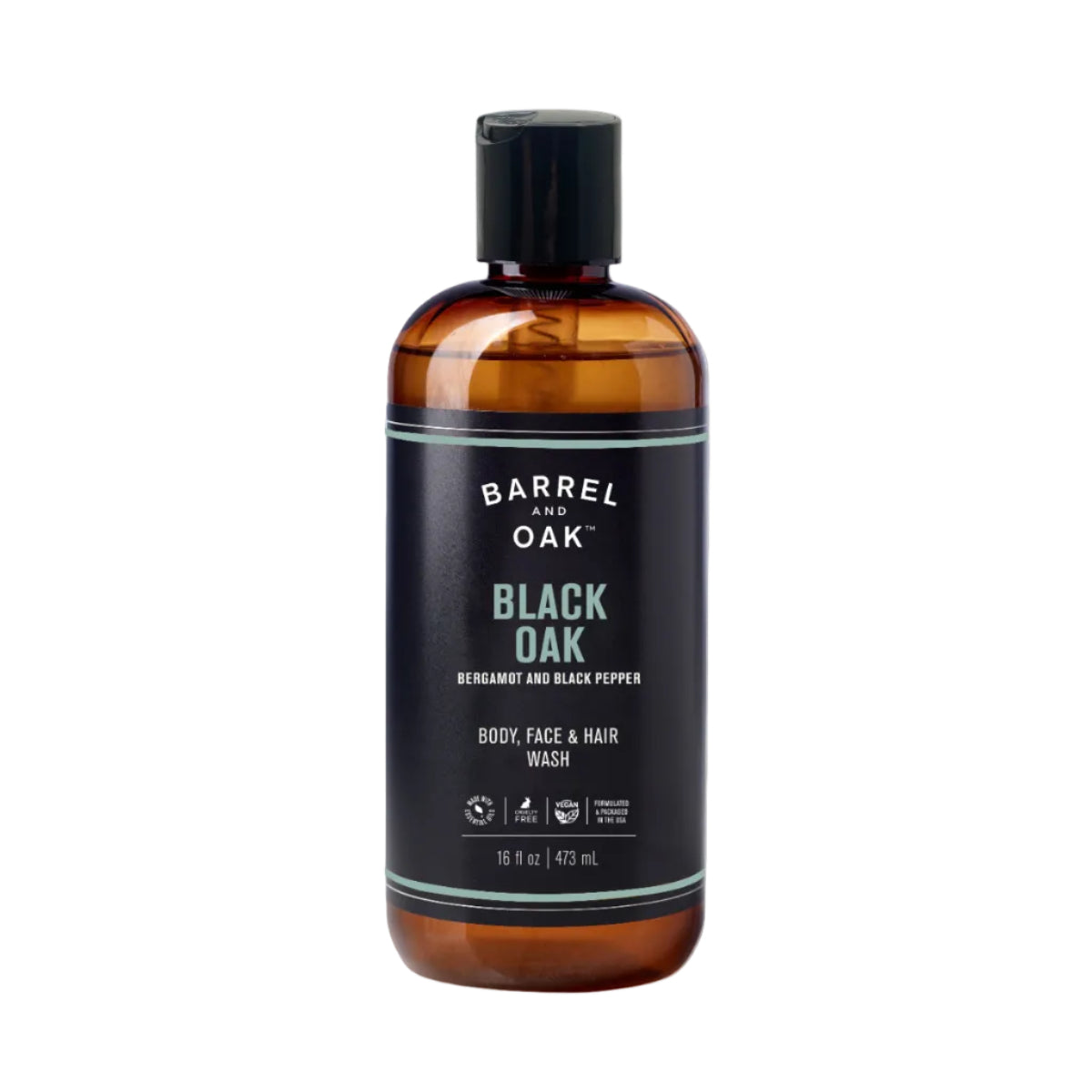 A 16 fl oz brown plastic bottle of Barrel and Oak Hair, Face, and Body All In One Wash - Black Oak, with a black cap and label featuring green and white text. This wash offers a bergamot and black pepper scent.