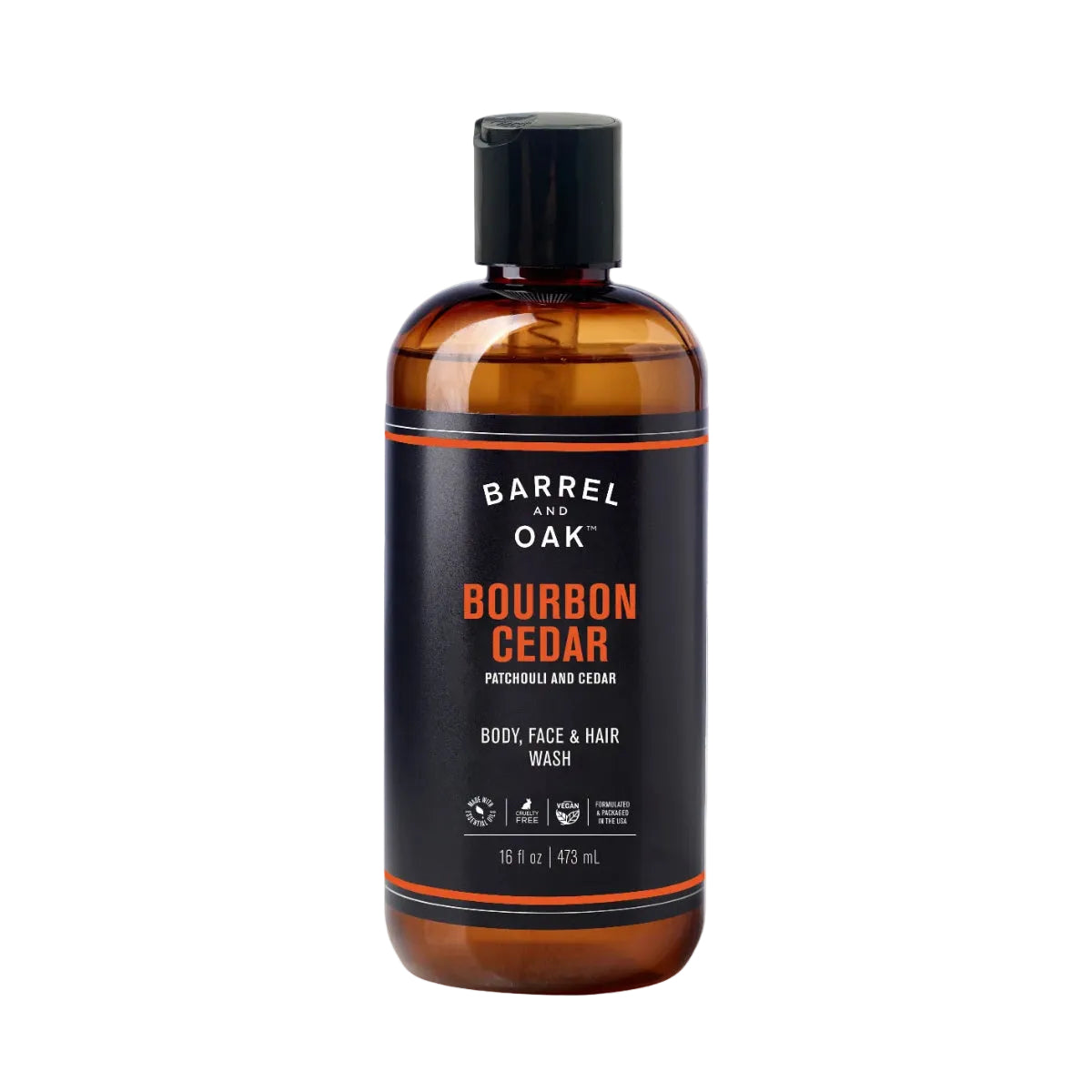 A 16 fl oz bottle of Hair, Face, and Body All In One Wash - Bourbon Cedar features a brown plastic design with a black flip cap, black label, and orange accents. This balanced cleanser is suited for multiple uses.