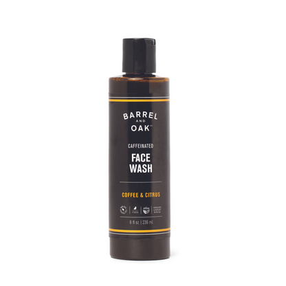 An 8 oz. bottle of Caffeinated Coffee & Citrus Face Wash with a black label, enriched with Coffee Seed Extract.
