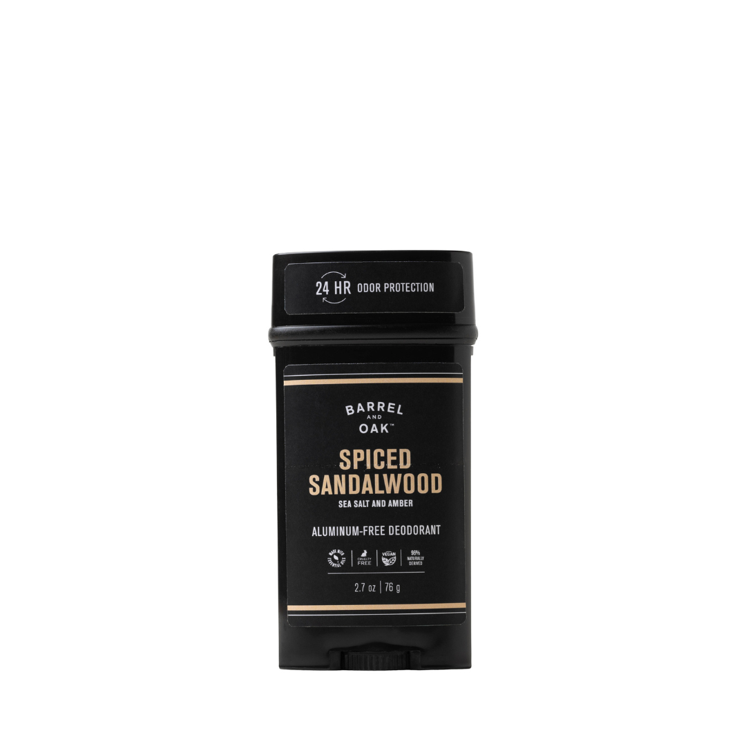 The Aluminum Free Deodorant - Spiced Sandalwood 2.7 oz delivers 24-hour odor protection with a vegan, aluminum-free formula for clean, natural freshness. The black stick features gold and white text.
