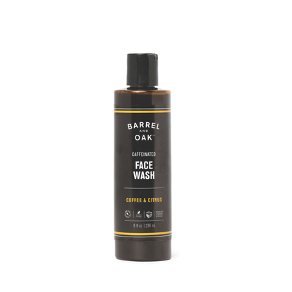 An 8 oz. bottle of Caffeinated Coffee & Citrus Face Wash stands upright, featuring a black label with white and yellow text, against a plain white background.