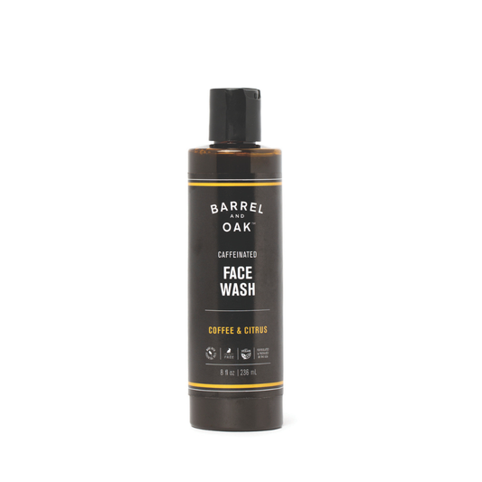 An 8 oz. bottle of Caffeinated Coffee & Citrus Face Wash stands upright, featuring a black label with white and yellow text, against a plain white background.